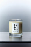 Le Sas Bon "The Orchard" organic and vegan candle in glass vessel with white rectangle branded sticker against a silver background