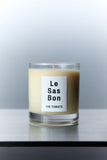 Le Sas Bon "The Tomato" natural and vegan candle in glass vessel with white rectangle branded sticker against a silver background