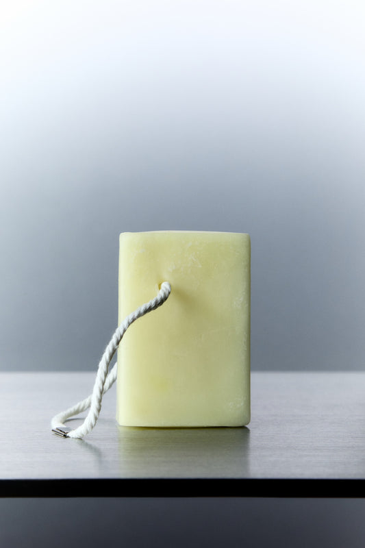 Scented wax melt cube plus rope handle on top of silver table